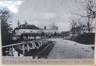 View of Bentley Heath with the almshouses in the centre. Postcard posted 1916. | Postcard by W A Bray. HALS ref MIS018 photo collection. Courtesy of Hertfordshire Archives & Local Studies